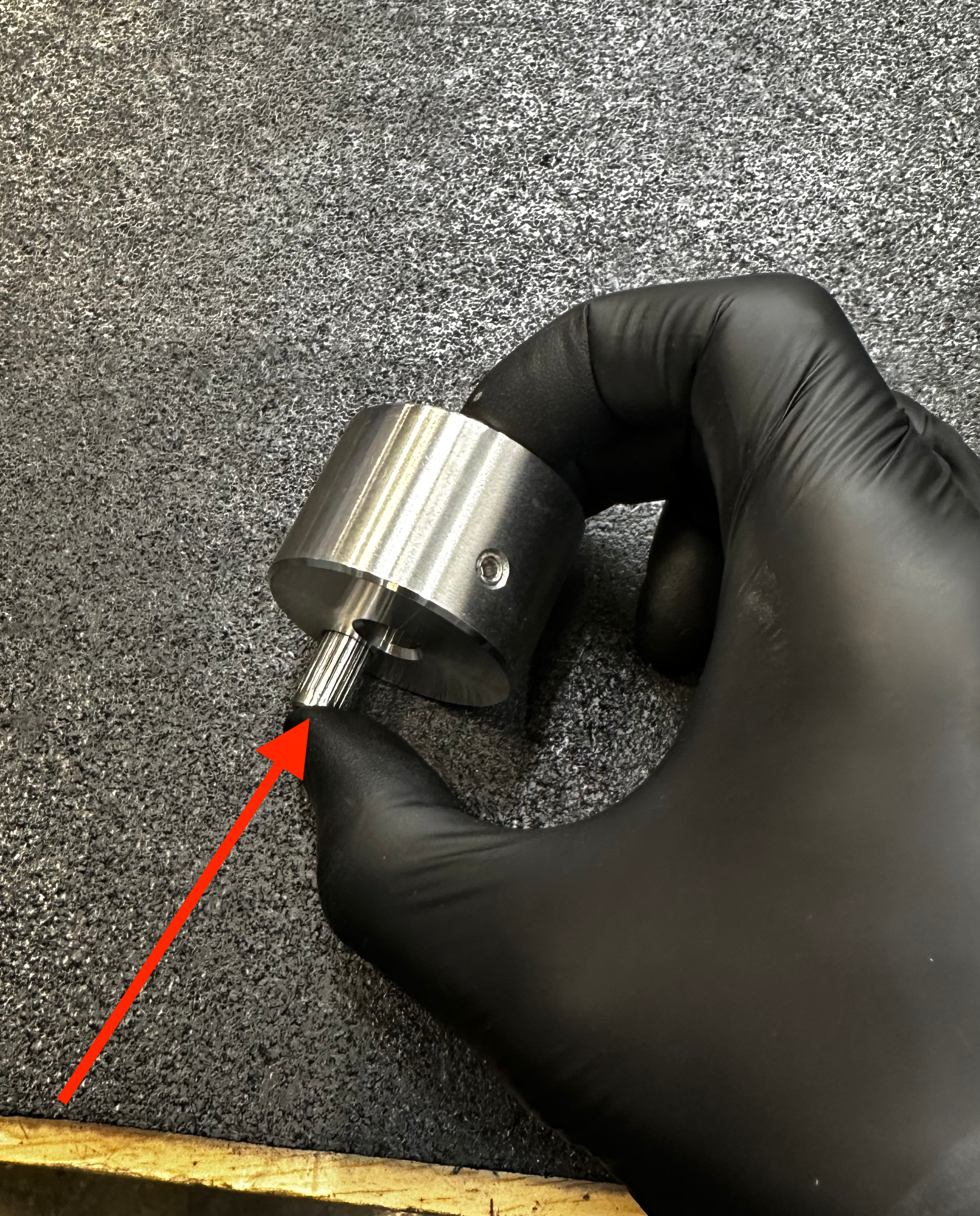 finished side of the pin through the back side of the crank.