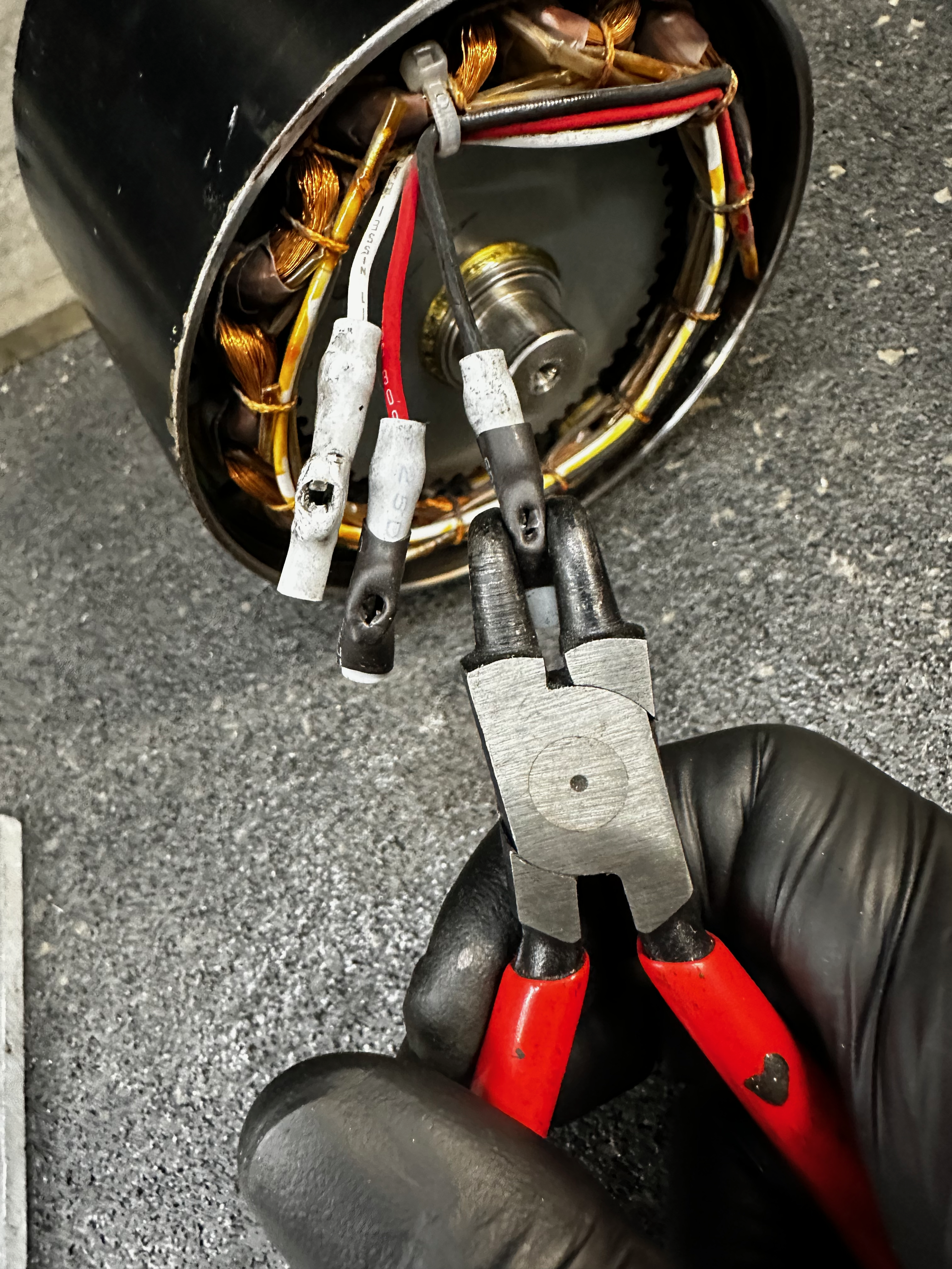 retaining ring plier squeezing the spade connectors.